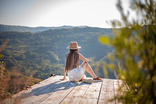 Female tourist enjoying peaceful mountain escape in nature