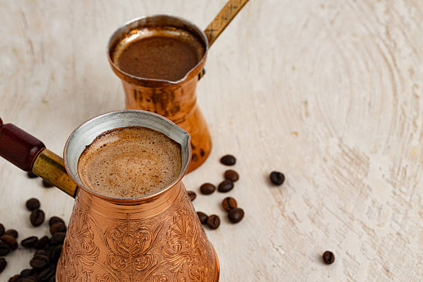 istock Close up of copper coffee turk on light textured surface 2234854644