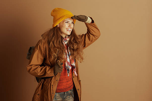 istock Curious Hiker Shields Eyes in Autumn Sun 2234855521