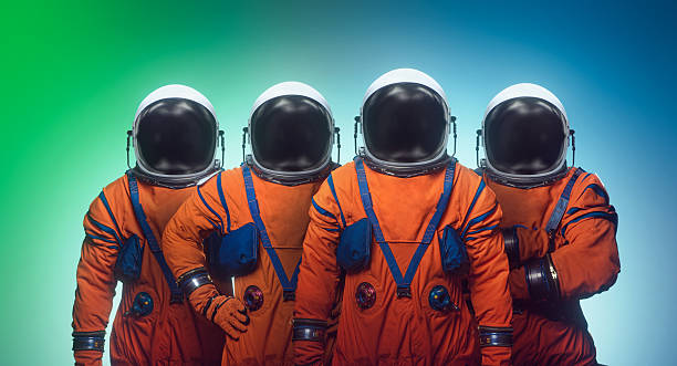 istock Astronauts in spacesuits on colorful bright background. Space crew expedition. Sci-fi space photo collage. Mixed media. Not AI content 2234857461
