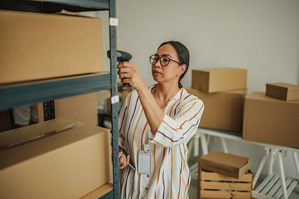 istock Warehouse manager efficiently handling packages and inventory in a small business environment 2234858430