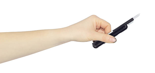 istock multitool for cleaning headphones in hand, outstretched hand with multitool for cleaning headphones isolated on background 2234859622