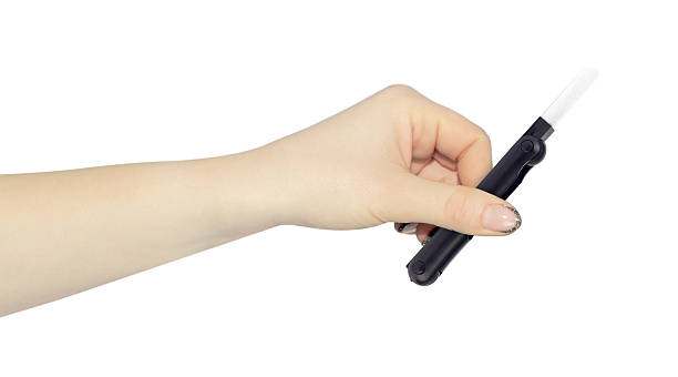 istock multitool for cleaning headphones in hand, outstretched hand with multitool for cleaning headphones isolated on background 2234859913