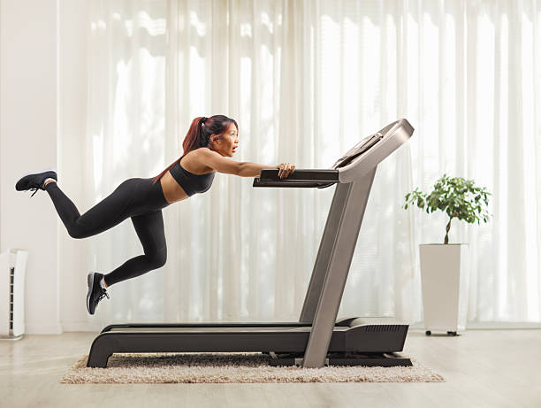 istock Young woman falling from a treadmill 2234860519