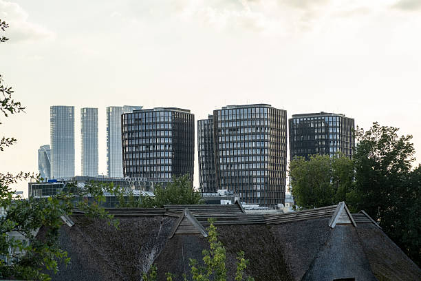 istock Modern Architecture Contrasts With Traditional Roofing in Urban Landscape During Evening Light 2234860743