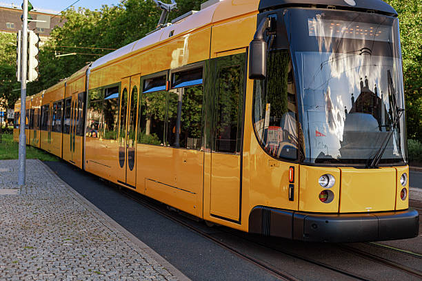 istock Modern yellow tram on city street 2234861104