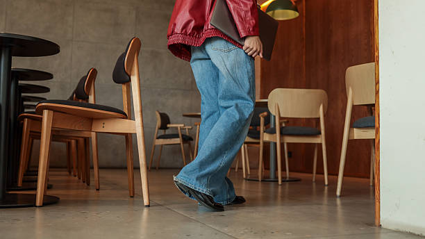 istock Person in a red jacket and jeans 2234861152