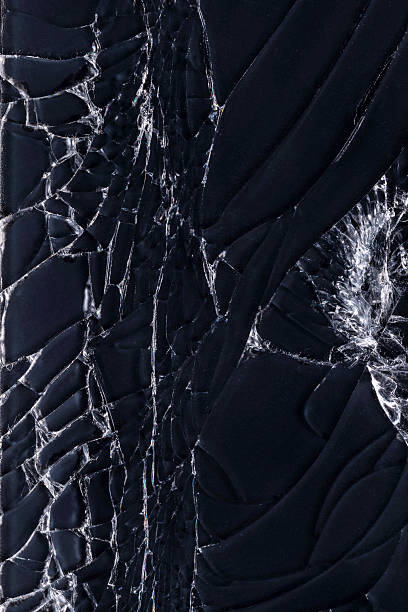 Close-up a broken glass with wrinkles and cracks, abstract of a broken cracked screen smartphone.