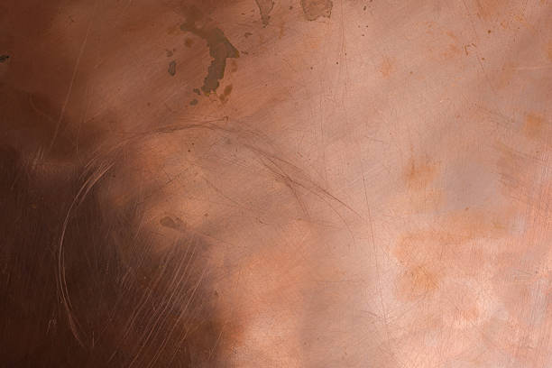 istock The scratched and stained copper surface is dark in the lower left corner. 2234865759