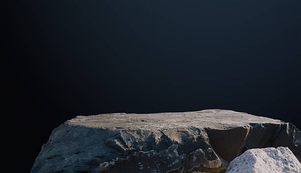 istock Stone podium on dark blue background for product display.Natural rock surface with dark gradient background,Studio wall room with stand pedestal mockup scene, minimal presentation with rock backdrop 2234869721