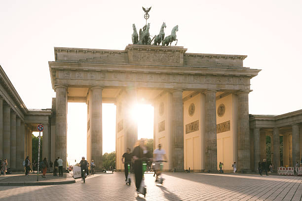 istock Sunlit Brandenburg Gate with Visitors in Berlin, Germany at Sunset 2234870030