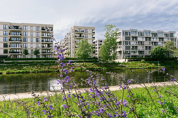 istock Modern Apartment Buildings by Spree River with Greenery in Berlin, Germany 2234870186