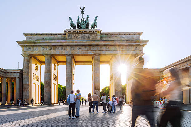 istock Sunlit Brandenburg Gate with Visitors in Berlin, Germany at Sunset 2234870924