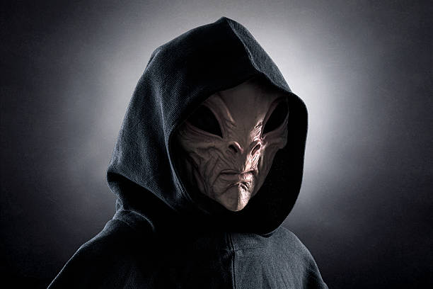 istock Mysterious humanoid alien at night over dark misty background 2234871645