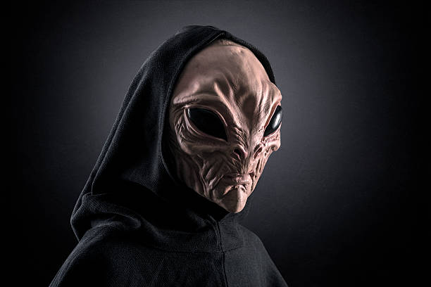 istock Mysterious humanoid alien at night over dark misty background 2234871734