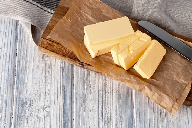 istock Cut butter on plate with blue towel on kitchen table 2234873488