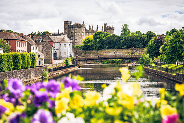 Kilkenny, Ireland - A view along the River Nore in central Kilkenny towards the historic Kilkenny Castle.