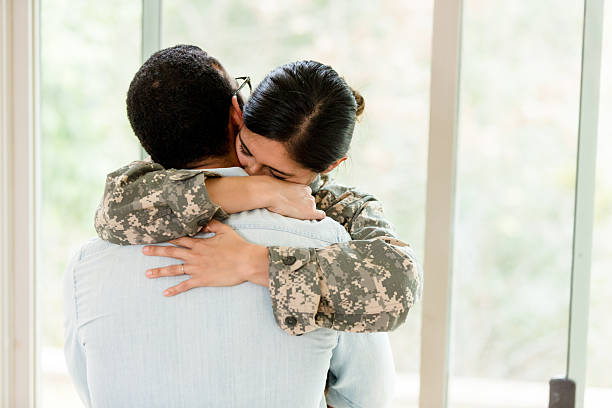 istock Emotional Reunion: Soldier and Loved One Embrace 2234876797