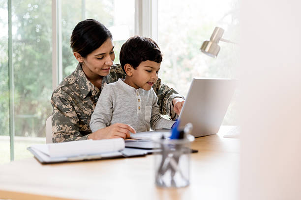 istock Military Mom and Son Using Laptop Together, Teamwork and Bonding 2234876854