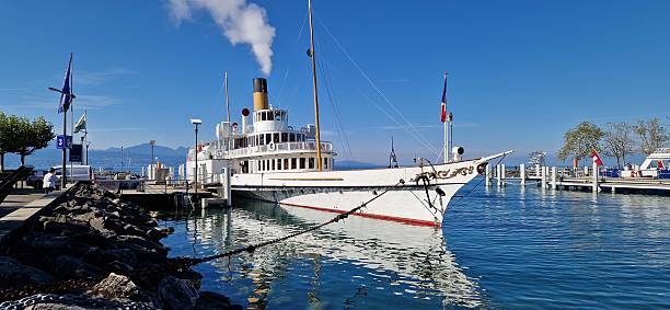 Lausanne Ouchy, Switzerland - August 25, 2025: Paddle steamer anchored in port at Ouchy on Lake Geneva, Lausanne, Switzerland
