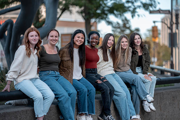 istock Group of Diverse Friends Smiling and Posing Outdoors on a Sunny Day 2234879342