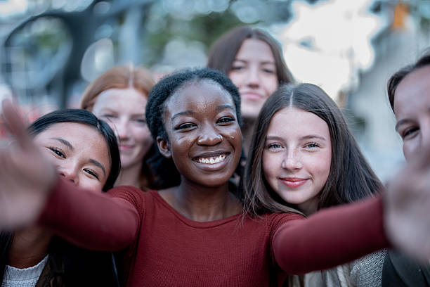 istock Smiling Diverse Friends Taking a Selfie Outdoors in a Casual Setting 2234879611