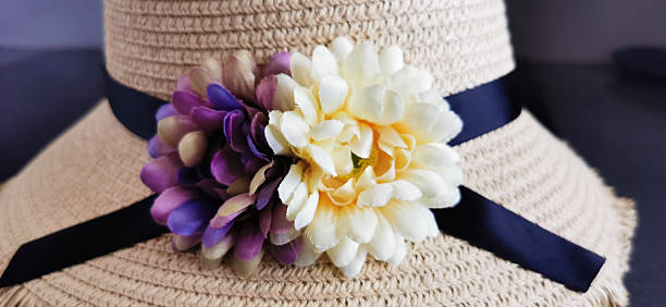 Women's straw hat with two large flowers on it