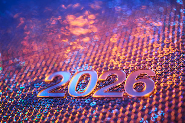 istock Metallic 2026 Numbers on Sparkling Sequin Background with Festive Lighting 2234882740