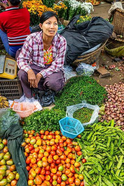istock Burmese woman selling fresh vegetables, Myanmar 2234884067