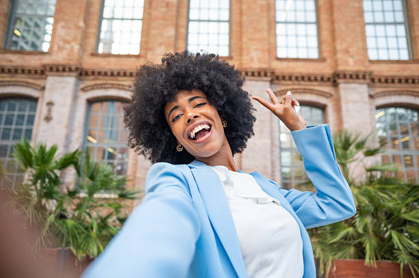 istock Young businesswoman taking a selfie while making a peace sign 2234884758