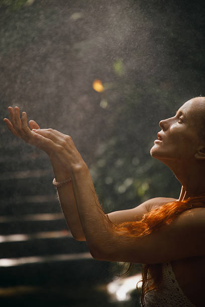 istock Serene woman enjoying sunlight rays in a tranquil natural setting outdoors 2234884826