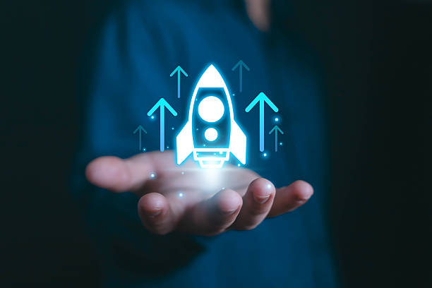 istock Startup growth and innovation concept with a glowing rocket icon launching upward, symbolizing entrepreneurship, new business opportunities, and digital transformation success rocket start flying up 2234886649