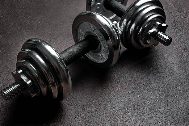 istock Heavy dumbbells on dark background 2234887172