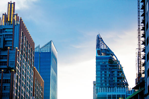 Modern Bangkok skyscraper skyline in sunset light along Wat Sri Bunruang Watergate canal in Bangkok Lumphini, Pathum Wan