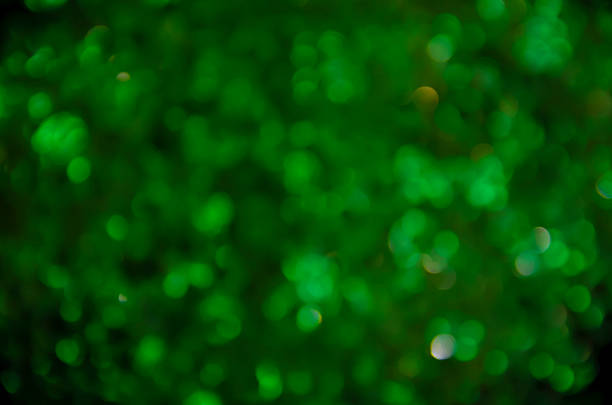 istock Green glow. Abstract background. Light and bokeh. Abstraction circles on a black background. 2234888624