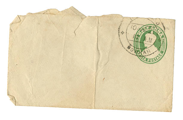 A much-handled old envelope posted in Howrah, India, in 1921. It bears a printed half-anna postage stamp featuring King George V, Emperor of India.