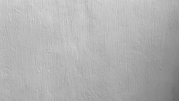 istock Close up of white painted wall surface showing textured details. Simple background suitable for construction material, design backdrop, or minimal abstract pattern. 2234891863