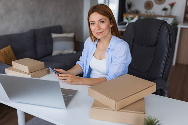 istock Entrepreneur managing online orders from home office using smartphone 2234900147