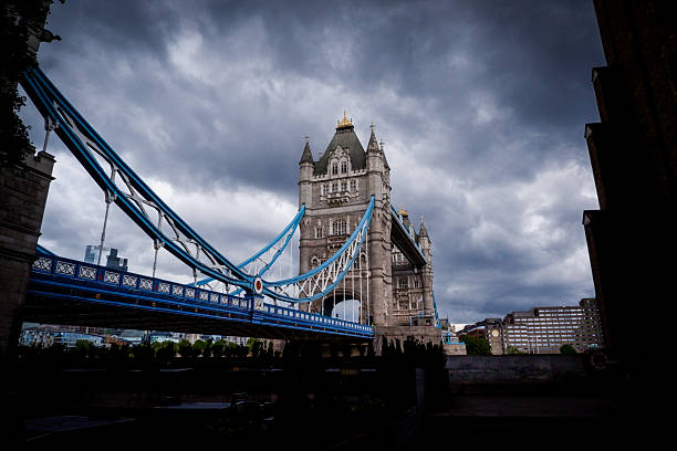 Tower Bridge with a dramatic sky.London, the capital of England and the United Kingdom, is a highly contemporary city with a history dating back to ancient Rome.