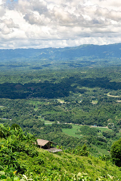 istock Scenic Vista Lush Green Valley and Mountain Range under Cloudy Sky. 2234904439