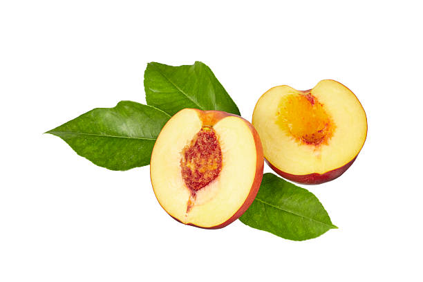 istock ripe halved peach with leaves isolated on white 2234905178