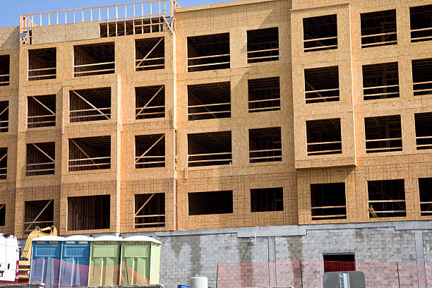 istock New construction large building with portable toilets 2234905753