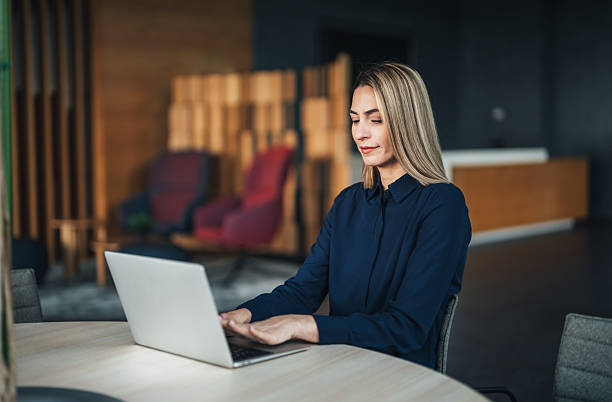 istock A successful businesswoman is using a laptop and working in the office 2234907724
