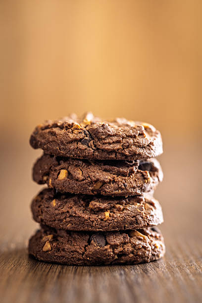 istock Sweet chocolate cookies on wooden table. 2234907914