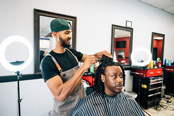 istock Barber working on client's haircut 2234912037