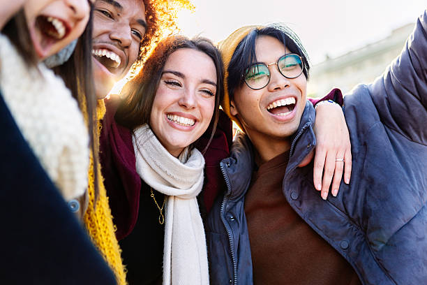 istock Diverse group of young friends having fun together outdoors on winter 2234912803