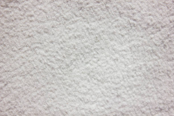 White delicate soft plush fleece fabric texture background. Background pattern of soft warm material