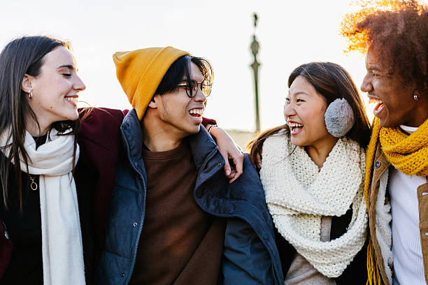 istock Diverse group of young friends having fun together outdoors on winter 2234913011