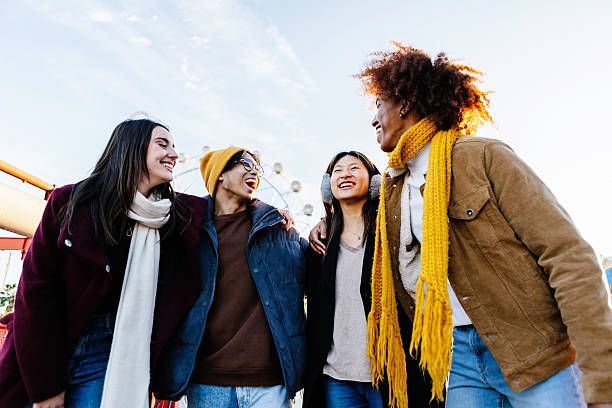 istock Diverse group of young friends having fun together outdoors on winter 2234913099