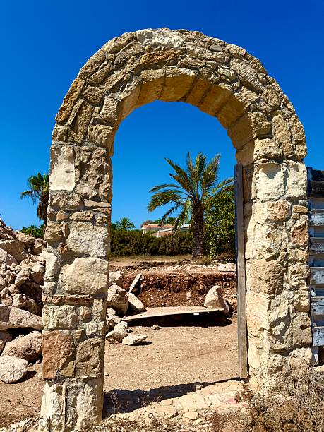 istock Stone archway of ancient ruins against blue sky. 2234914500